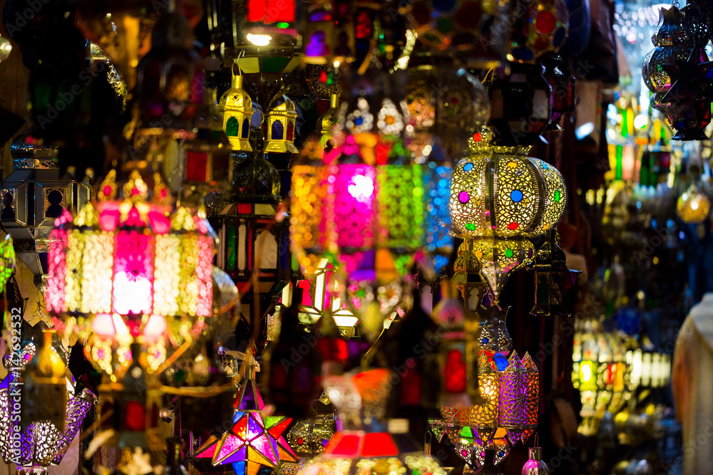 Vibrant colourful handmade tin lamps on medina market