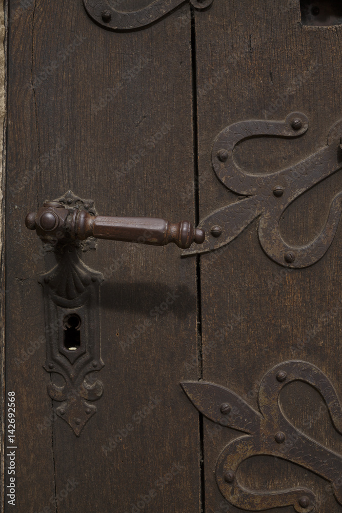 Old wooden door with rusty handle Architecture Old wooden door with rusty handle Architecture