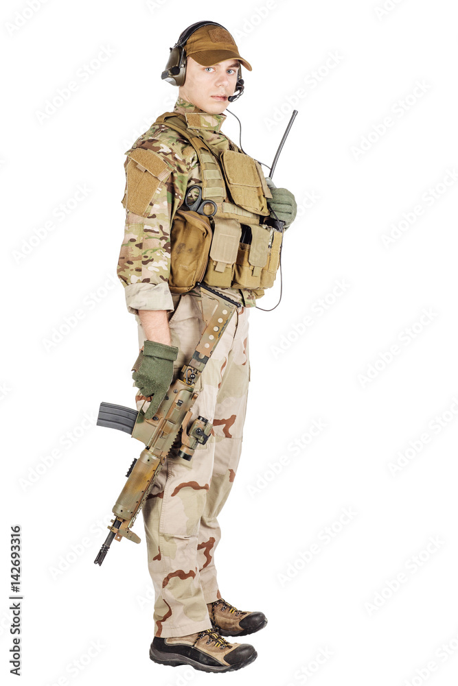 Obraz premium Portrait soldier or private military contractor holding sniper rifle. war, army, weapon, technology and people concept. Image on a white background.