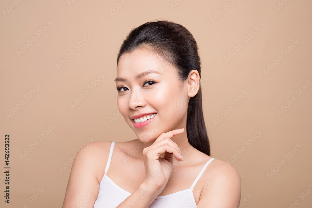 Beauty face. Facial treatment. Young asian woman with clean perfect skin touch her face. Beauty face. Facial treatment. Young asian woman with clean perfect skin touch her face.