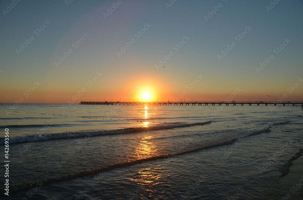 Fototapeta premium Sunset in autumn evening over Black Sea in resort village