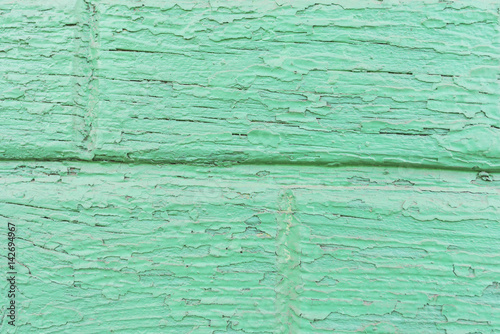 Background of old colored lime-colored boards with a geometric pattern