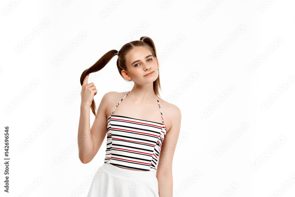 Young pretty girl smiling, isolated on white background. Young pretty girl smiling, isolated on white background.