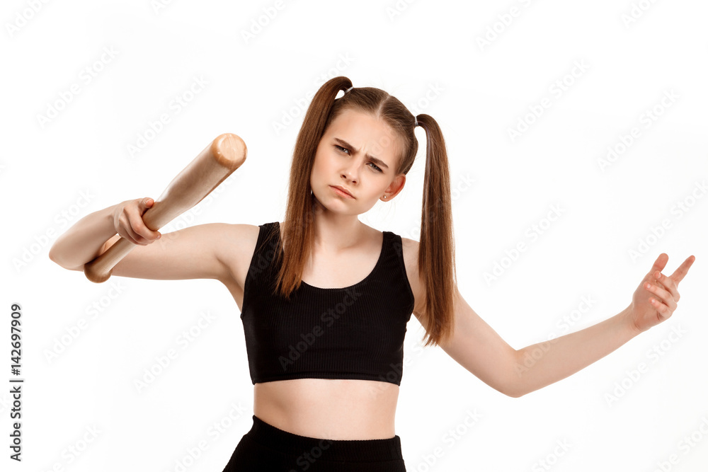 Young pretty girl posing with bat, isolated on white background. Young pretty girl posing with bat, isolated on white background.