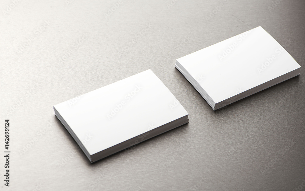 Top view of business card over gray background. Top view of business card over gray background.