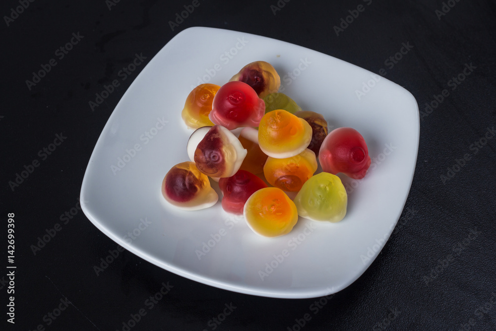 Colorful candies, jelly on a plate. Top view. Colorful candies, jelly on a plate. Top view.