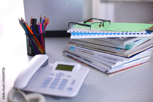 Group of multicolored office folders and glasses