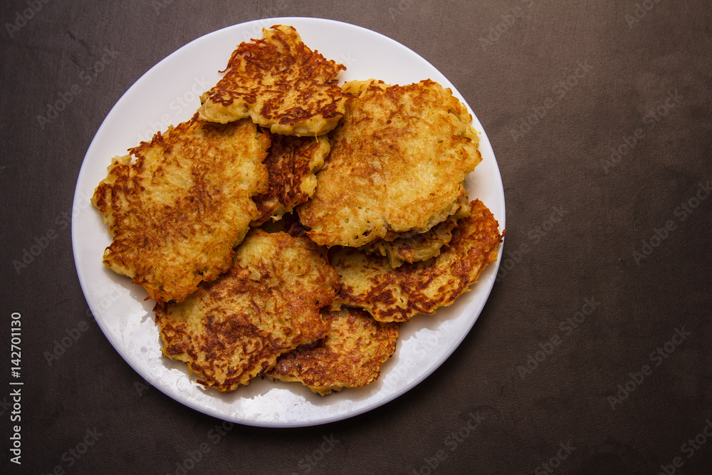 potato pancakes, tasty food, Black background potato pancakes, tasty food, Black background