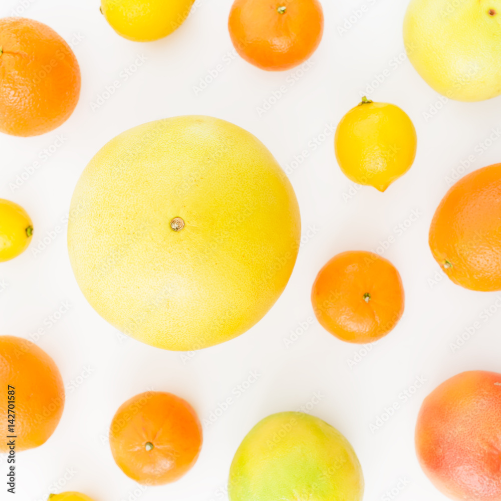 Fruit pattern. Lemon, orange, mandarin, grapefruit and sweetie on white background. Flat lay, top view. Fruit pattern. Lemon, orange, mandarin, grapefruit and sweetie on white background. Flat lay, top view.