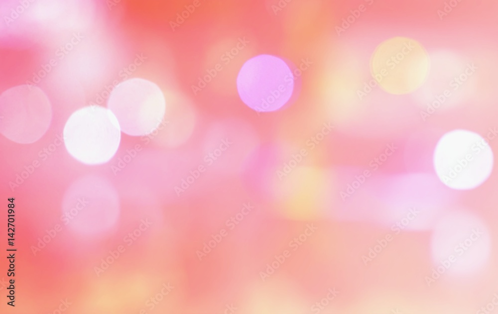Abstract multicolor blurred bokeh light on light pink blackground