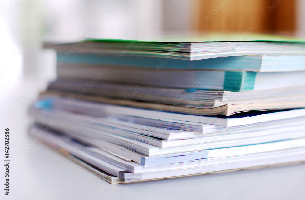 Group of multicolored office folders and glasses Group of multicolored office folders and glasses