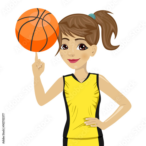 teenager girl spinning basketball ball with her finger