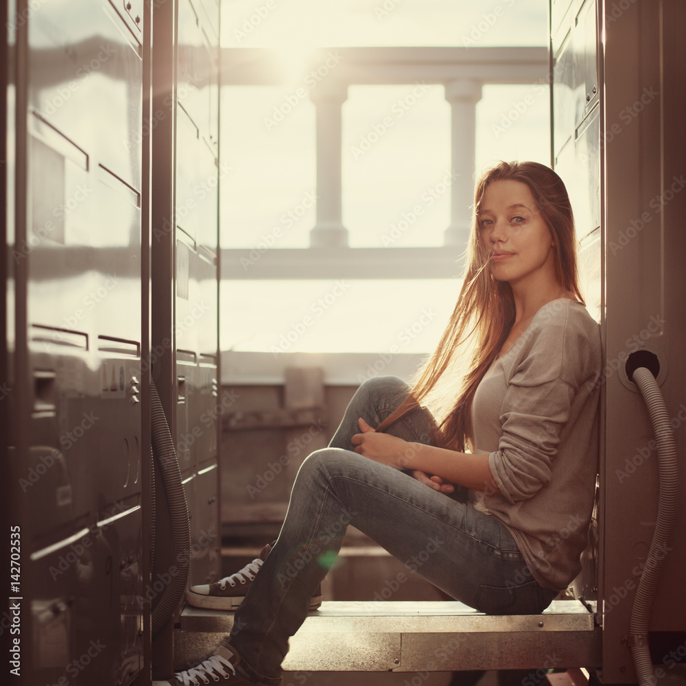 Outdoor fashion portrait of young woman