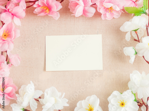 Frame of spring flowers on a wooden ,with space for text ,spring or summer theme