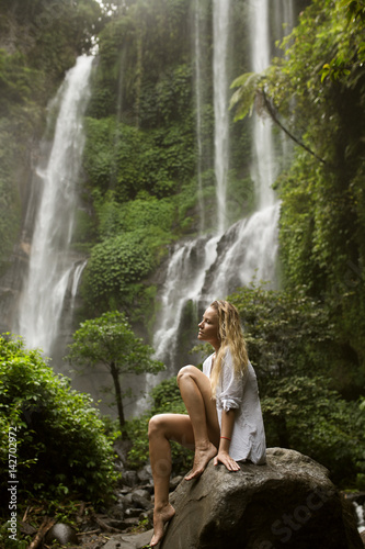 Beautiful woman and waterfall.