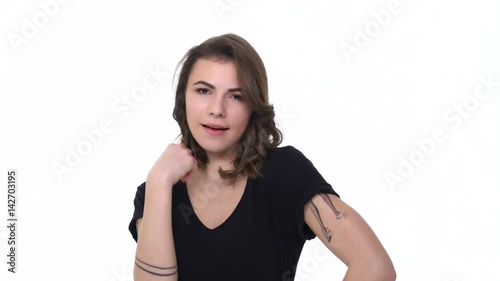 Attractive young woman flirting and doing beckon gesture with finger isolated