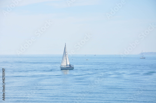 Yachts and boats sailing along the calm water of the Mediterranean Sea during the day