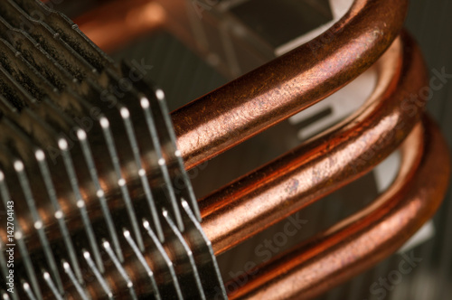 Part of cooling system with copper pipes. Industry and technology concept. photo