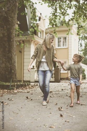 Wallpaper Mural Mother walking with her daughter. Torontodigital.ca