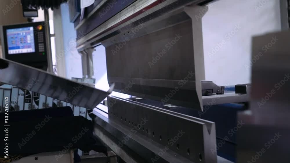 Hydraulic Press bends steel sheet. Close-up.
Hydraulic Press bends steel sheet. Close-up.