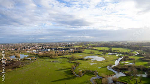 Aerial view of a lake and river area in the countryside late afternoon in the winter © Anthony