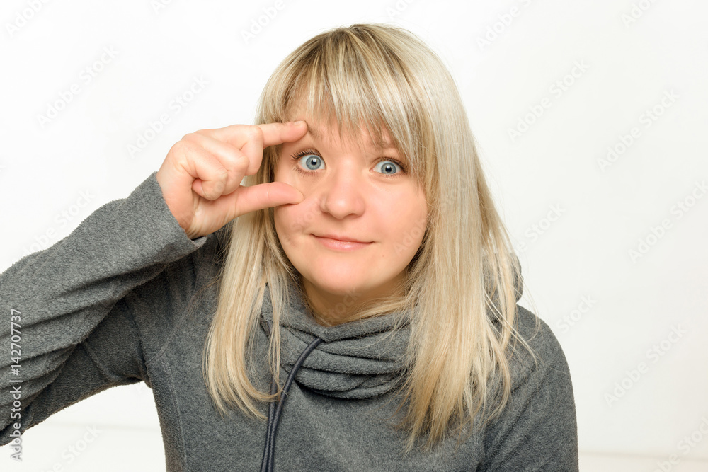 Beautiful girl makes an appearance on a white background Beautiful girl makes an appearance on a white background