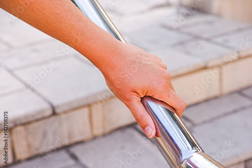 Fotografia, Obraz Woman hand on handrail