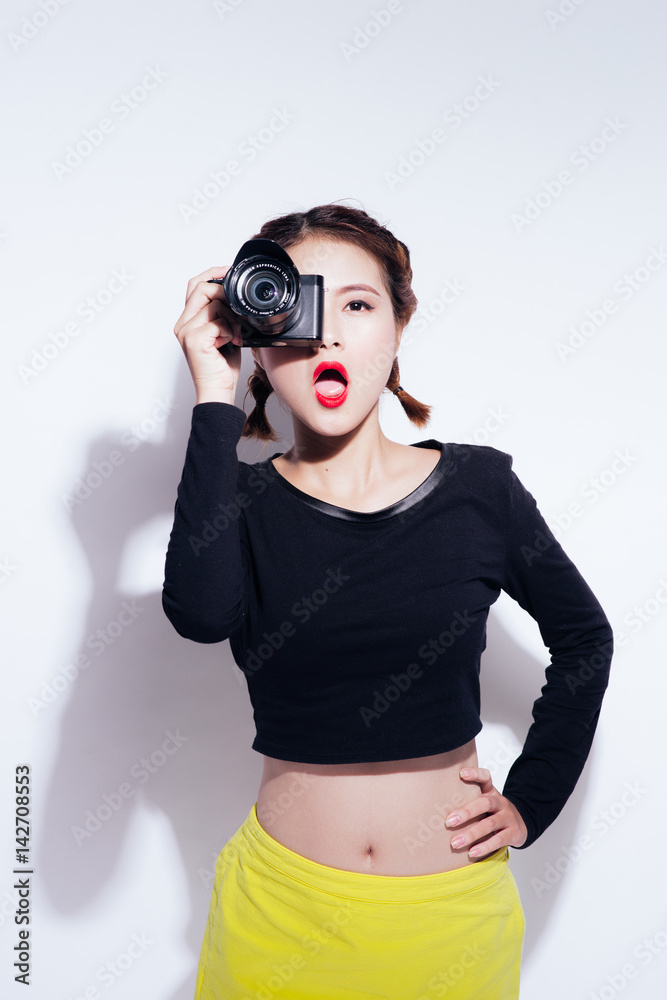 Close up Portrait of beautiful woman with retro hipster camera having fun Close up Portrait of beautiful woman with retro hipster camera having fun
