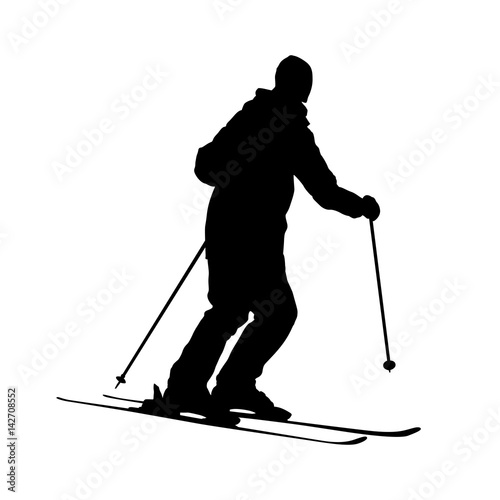 silhouette of skiing man.