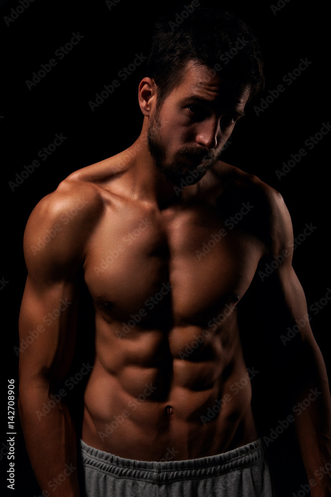 Muscular and defined six pack abs on handsome male model