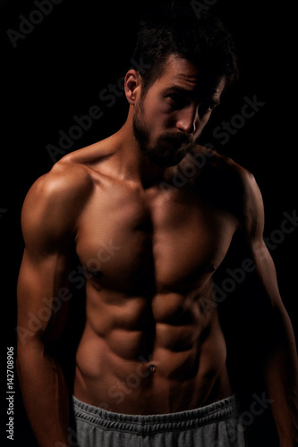 Muscular and defined six pack abs on handsome male model © Cherries