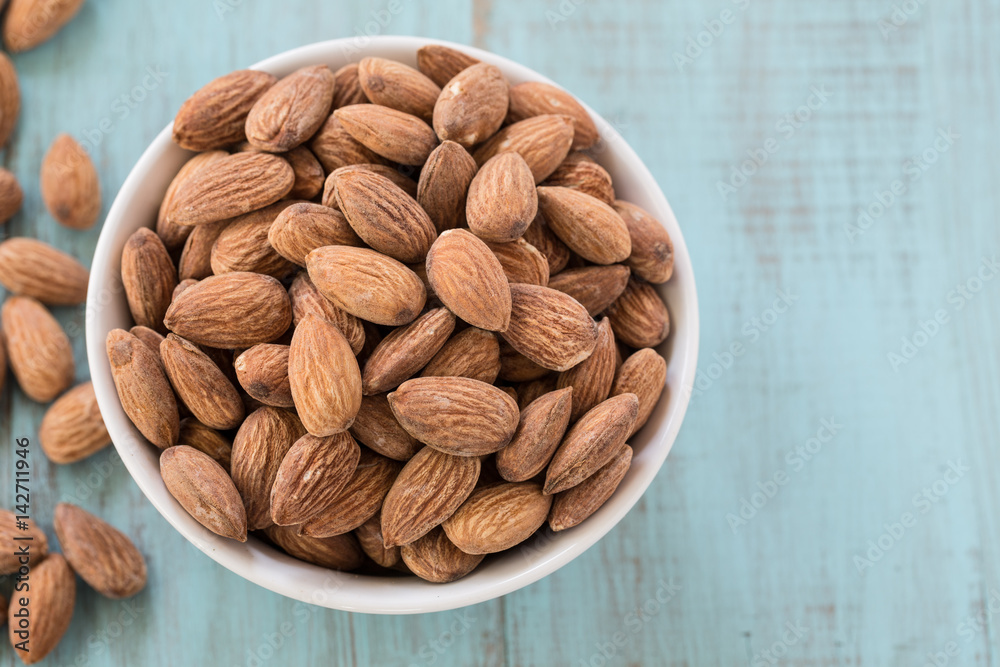 Almonds On Blue Wood Background From Above Almonds On Blue Wood Background From Above