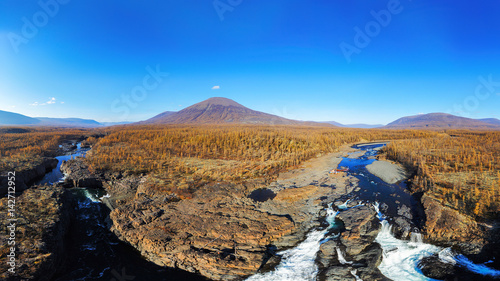 Nature panoramic Aerial view landscape of Siberian at autumn. Nature mountains, river and waterfall autumn view. Landscape mountains.