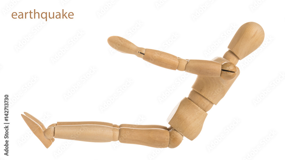 demonstration of wood manikin in earthquake exercise pose on white background. demonstration of wood manikin in earthquake exercise pose on white background.