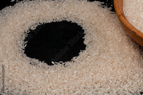 Closeup rice on black background empty space