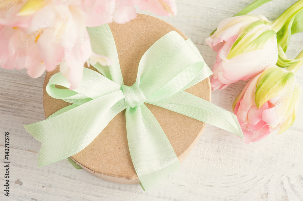 Pink tulips and gift box with green ribbon Pink tulips and gift box with green ribbon