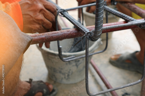 hands of builder worker wires