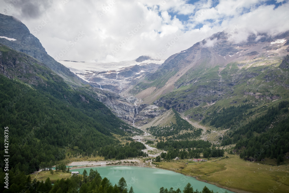 View on the Morteratsch glacier in St. Moritz with a lake in front