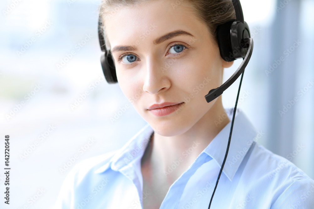 Call center operator. Portrait of beautiful business woman in headset.