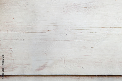 light green wooden top of a table with veins and signs of aging