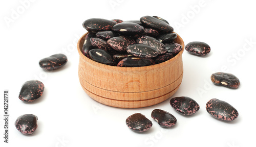 kidney beans on wood plate isolated on white background