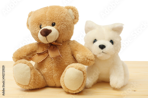 toy teddy on wood background © Tatiana