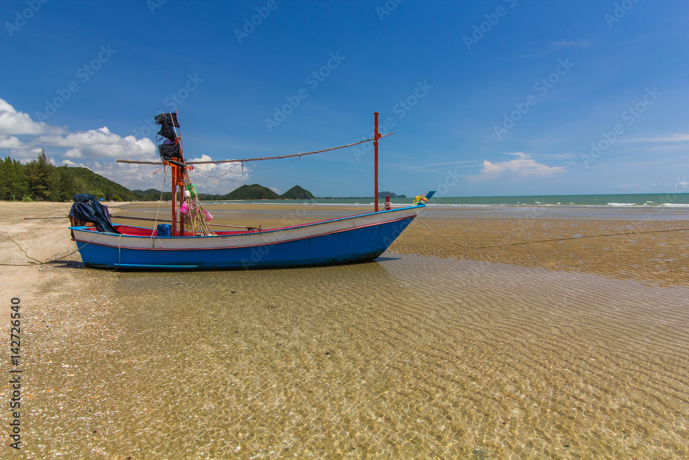 Fishing boat on Sam Roi Yot beach, Prachuap Khiri Khan, Thailand.