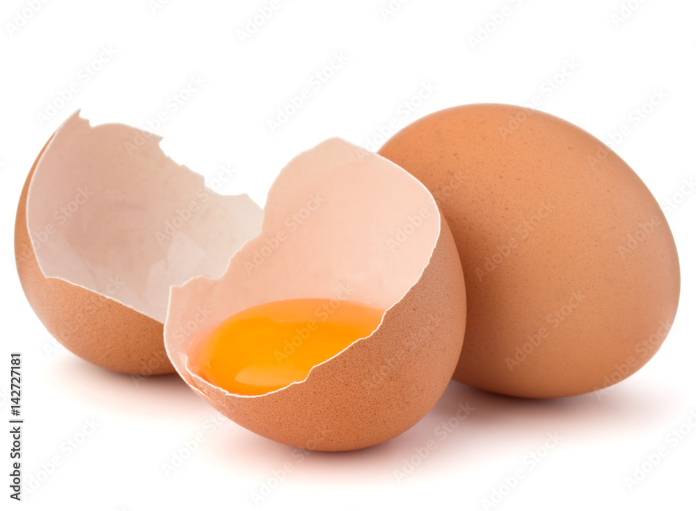 Broken egg in eggshell half and raw egg isolated on white background cutout Broken egg in eggshell half and raw egg isolated on white background cutout
