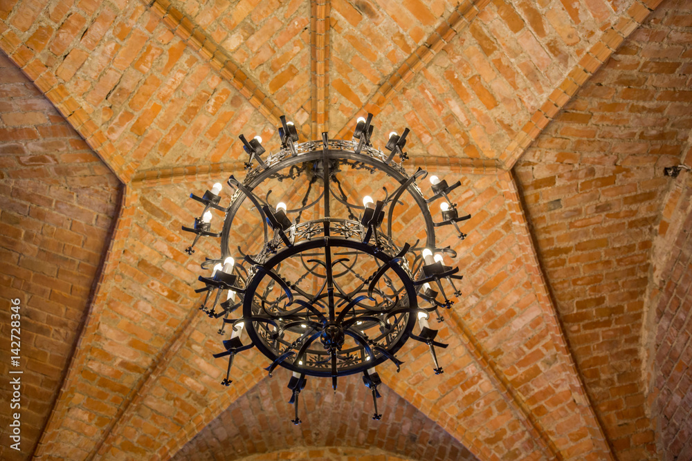 Obraz premium Chandeliers inside a castle in Trakai, Lithuania