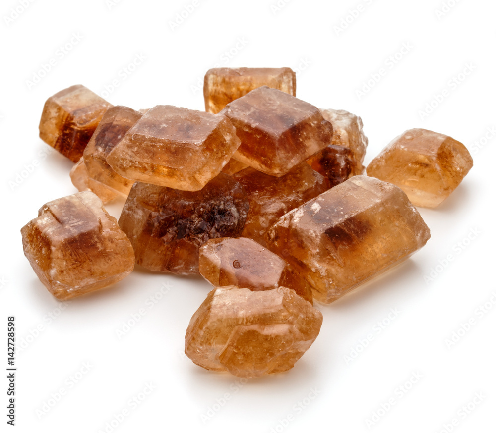 Brown caramelized lump cane sugar cube isolated on white background cutout Brown caramelized lump cane sugar cube isolated on white background cutout
