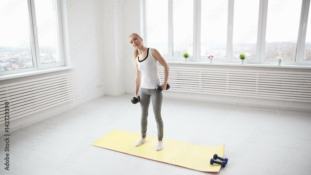 Beautiful fitness woman in the gym - dolly shot Beautiful fitness woman in the gym - dolly shot