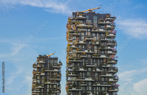 Modern Eco Building And Fast Clouds in Spring with Pink Cherry Trees
