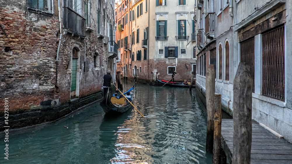 Gondolas on small canal in Venice