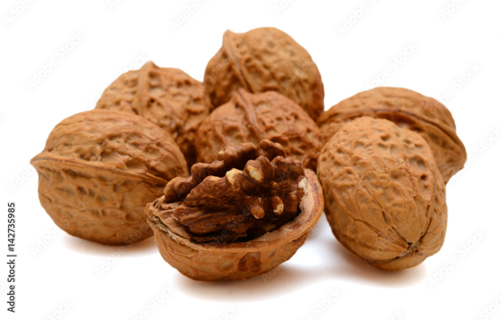 Cracked walnuts isolated on white background Cracked walnuts isolated on white background